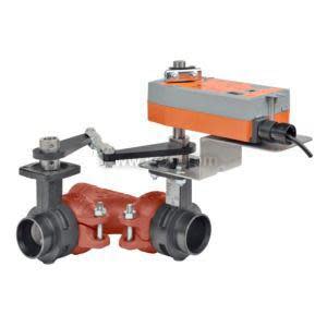 A double red grooved valve linked to a long orange electric actuator via a black lever mechanism and mounted on a metal bracket, pictured against a white background.