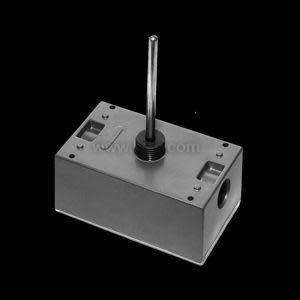 Square grey metal box with a slender metal rod sticking up from the top; the sides have round punch-outs for wiring.