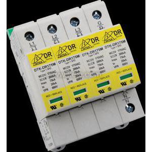 A DIN-rail mounted surge protector with four narrow white units side by side, each with a yellow label and connection screws at the top and bottom.