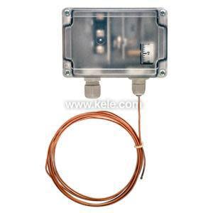 Clear plastic housing with copper capillary tube coiled around sensor