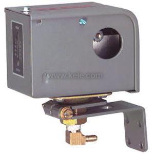 Grey metal pressure switch box with small indicator window, L-shaped mounting bracket, and brass pressure fitting at the bottom