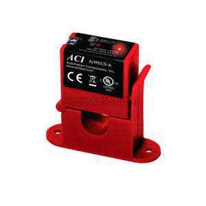 Small red plastic current switch module with green terminal block.