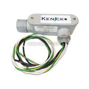 A small gray cylindrical housing labeled Kenick with several green, yellow, white and black wires extending from it.