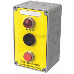 Yellow rectangular panel with red round light, red push button and small speaker.