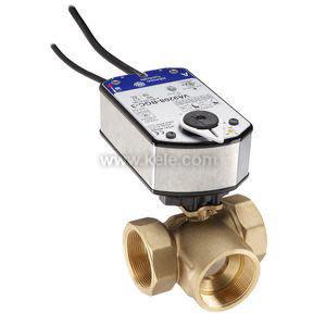 Gray actuator box with two black cords mounted atop a brass valve body with three openings.