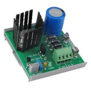 Green printed circuit board featuring a tall blue cylindrical capacitor, black heat sink and green screw terminal block