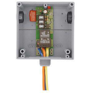 Time delay relay board in grey housing with wires.