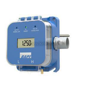 Square blue plastic device with a digital readout on top and two brass fittings at the bottom.