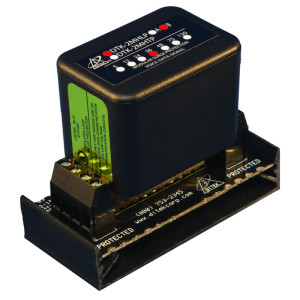 photo of a black Ditek surge protection module with a rectangular housing mounted on a black base, showing screw terminal connections and printed labels like 'PROTECTED'