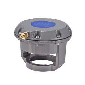 Round grey metal housing with a central knob on a base