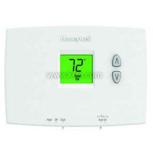 Small white digital thermostat with two arrow buttons