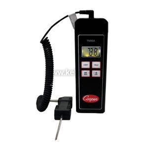 Black handheld device with LCD display reading 73.8 and a metal probe connected by a coiled cable