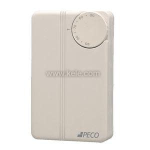 Rectangular beige thermostat with vertical grooves and a round temperature dial in the upper right corner