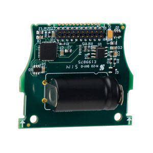 Small green circuit board with various chips and a prominent black cylinder on one side, plus a 20-pin header