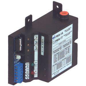 Black rectangular control unit with printed wiring chart, blue screw terminals, small DIP switch bank and red cap button