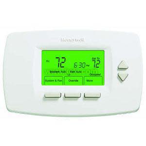 White digital thermostat with green display and buttons
