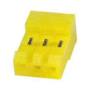 A small yellow plastic connector housing three evenly spaced metal prongs on the top.