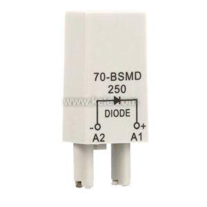 Small rectangular white electrical diode module with two prongs and printed markings indicating polarity and model number.