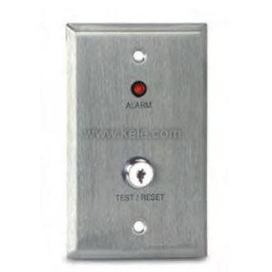 Small grey panel with a red LED, key switch and printed instructions