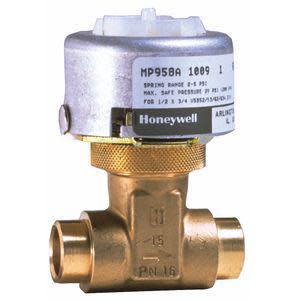A brass T-shaped control valve body with threaded pipe openings and a cylindrical silver actuator labeled "Honeywell MP958A 1009" mounted on top, standing against a neutral background.
