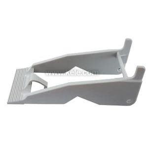 Image of a light grey plastic lever tool featuring a ribbed step at one end and hook‑like prongs at the other, used to remove components from electrical sockets.