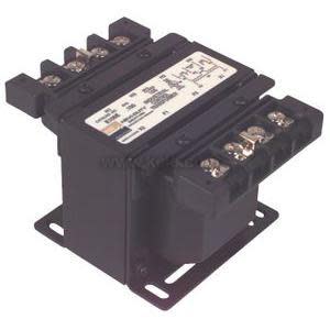 Black open-frame transformer with top terminal blocks and a mounting flange.