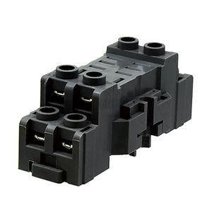 Rectangular black relay base with two pairs of metal contacts and circular insertion ports