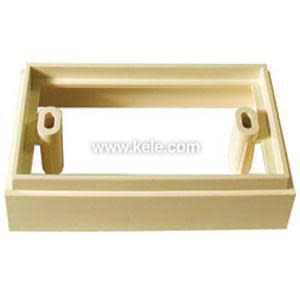 Empty rectangular beige plastic housing base with two oval mounting pillars inside, used as a wall mount for an electronic device.