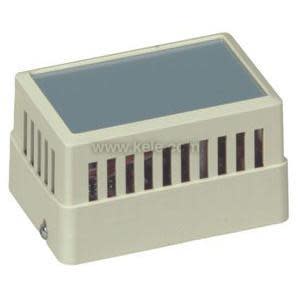 A small beige rectangular housing with vertical slats on the sides and a smooth grey top surface