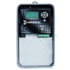 Compact timer controller mounted inside a gray enclosure with a screen and buttons.