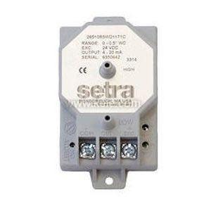 Small grey octagon-shaped pressure transducer with three screw terminals and printed label.