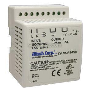 Cube-shaped off-white power supply with a row of terminal holes on the top and vent openings on the side