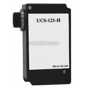 Black plastic box with smooth top connected to a white multi-core cable