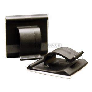 Pair of small square plastic pads with sticky back; each has a curved clip to hold a cable.