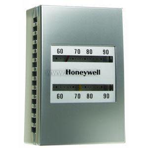 Metallic rectangular thermostat with two horizontal viewing windows showing temperature scales and the Honeywell logo