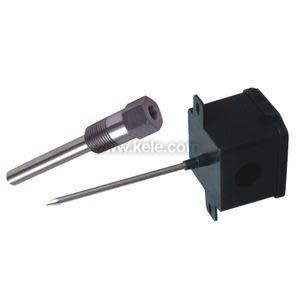 Small black box with a thin silver rod attached; includes a shiny cylindrical sleeve with threads.