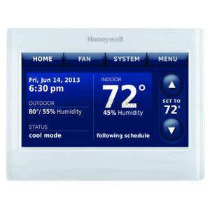 White touchscreen thermostat displaying temperatures on a blue screen