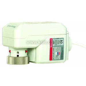 Rectangular white actuator with protruding metal stem and wires.