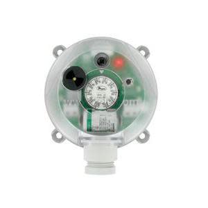 Circular clear plastic enclosure revealing an internal pressure gauge dial, LED indicators and circuitry, with four mounting tabs and a cable gland at the bottom.
