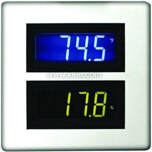 Wall-mounted display with digital temperature and humidity readings.