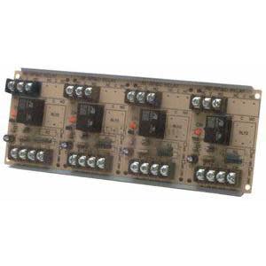 Brown circuit board populated with four white relays, indicator LEDs and terminal strips