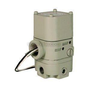 Tan-colored cylindrical control valve with multiple threaded openings and a thin black wire looped through one side.