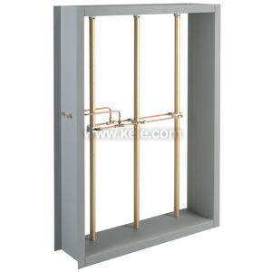 Gray rectangular frame with three vertical copper pipes and a horizontal copper tubing assembly