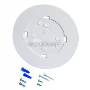 Circular white mounting bracket with holes and included screws and anchors.