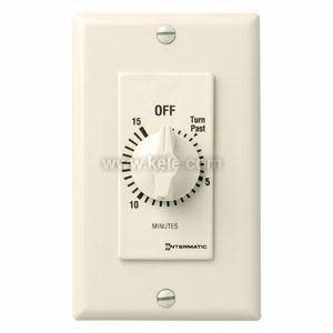 A cream colored wall-mounted timer with a round dial marked in minutes up to 15 and an off position.