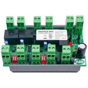 Green printed circuit board populated with several plug-in green connectors, black relays, red switches and a capacitor.