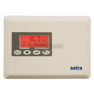 Rectangular beige Setra device with a red screen showing pressure readings and four small round and arrow buttons beneath the screen.