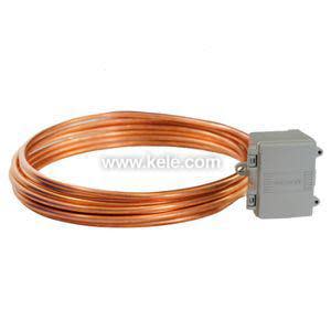 Coil of copper tubing attached to a small grey sensor box.
