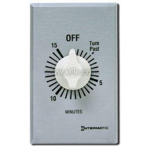 Wall‑mounted timer switch with metal plate and white knob marked from 0 to 15 minutes.