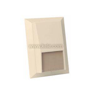 Beige wall plate with angled top and rectangular cutout at bottom